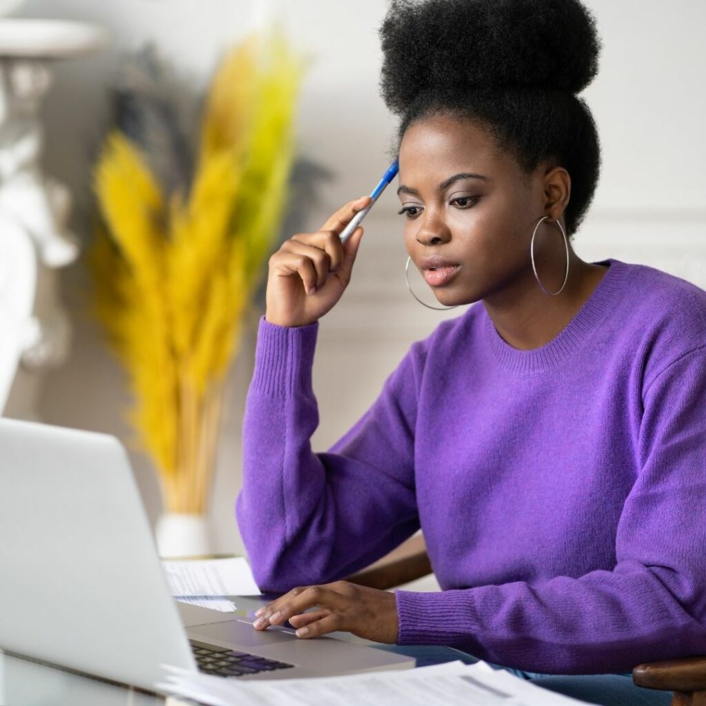 woman researching on laptop