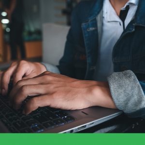 Close-up of someone using a laptop.