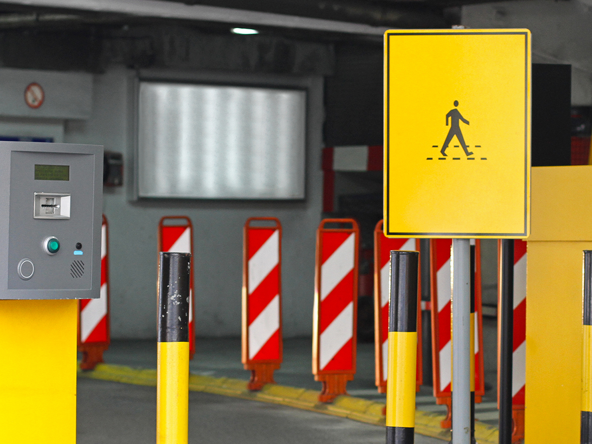 walk sign in parking garage