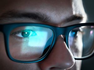 Image of a man with bluelight blocking glasses
