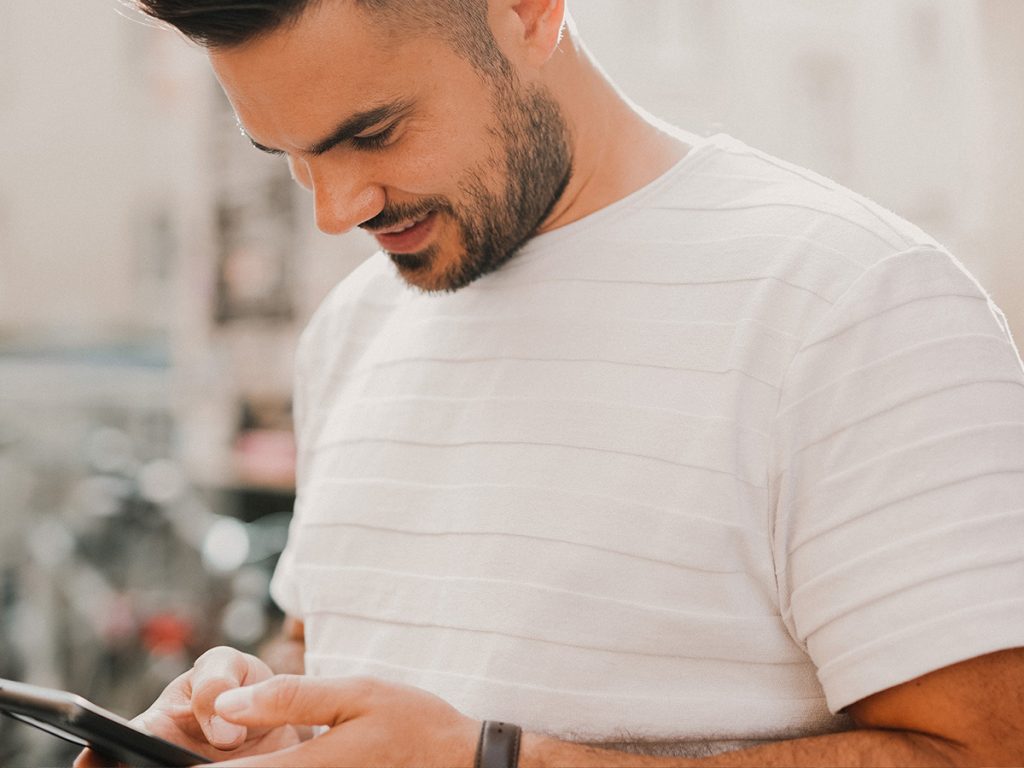 man looking at phone