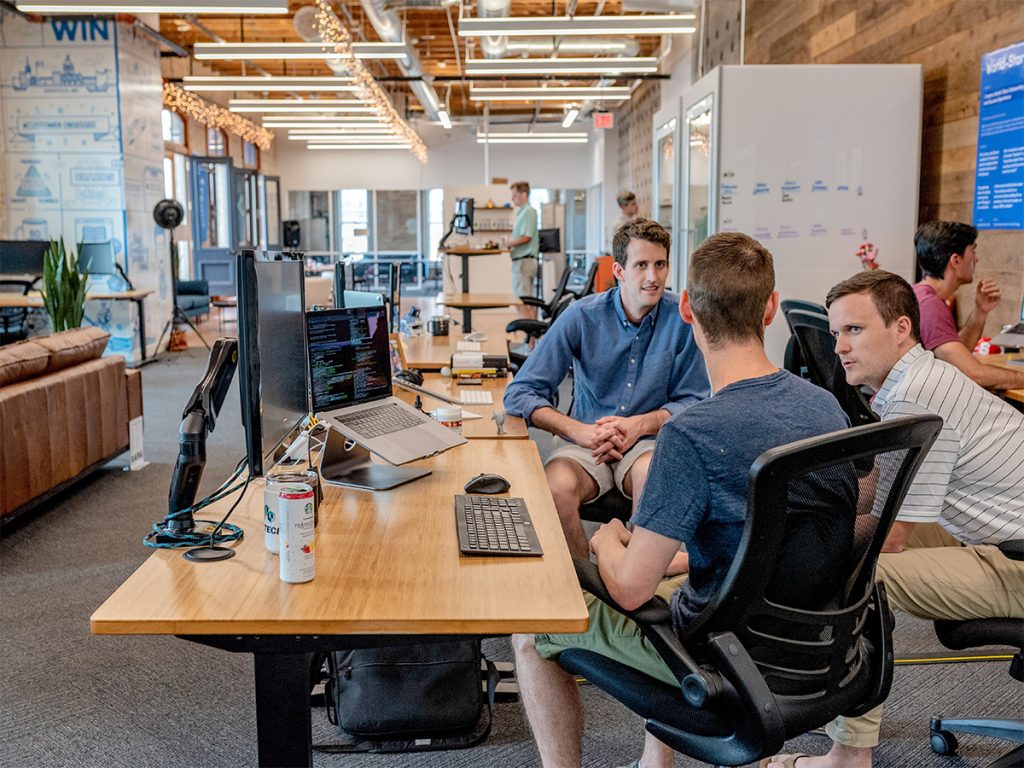 group of developers having a discussion in office